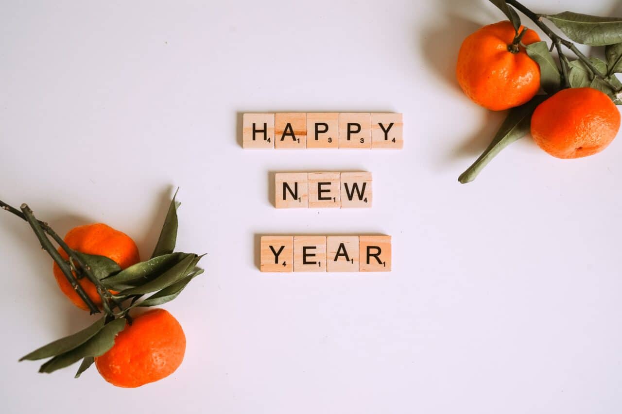Letter tiles that spell happy new year.